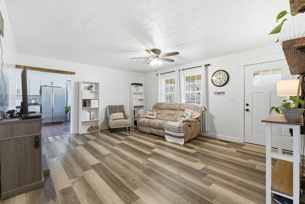 114 Viars Road Philadelphia, TN 37846 - Photo 9 of 45 a spacious bedroom with a bed and a chandelier