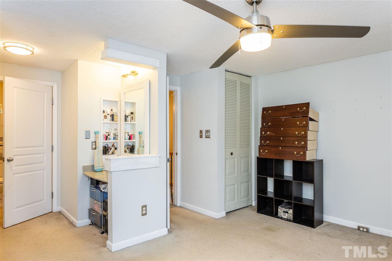 7720 Sandra Lane Raleigh, NC 27615 - Photo 13 of 25 a view of kitchen with hallway and closet