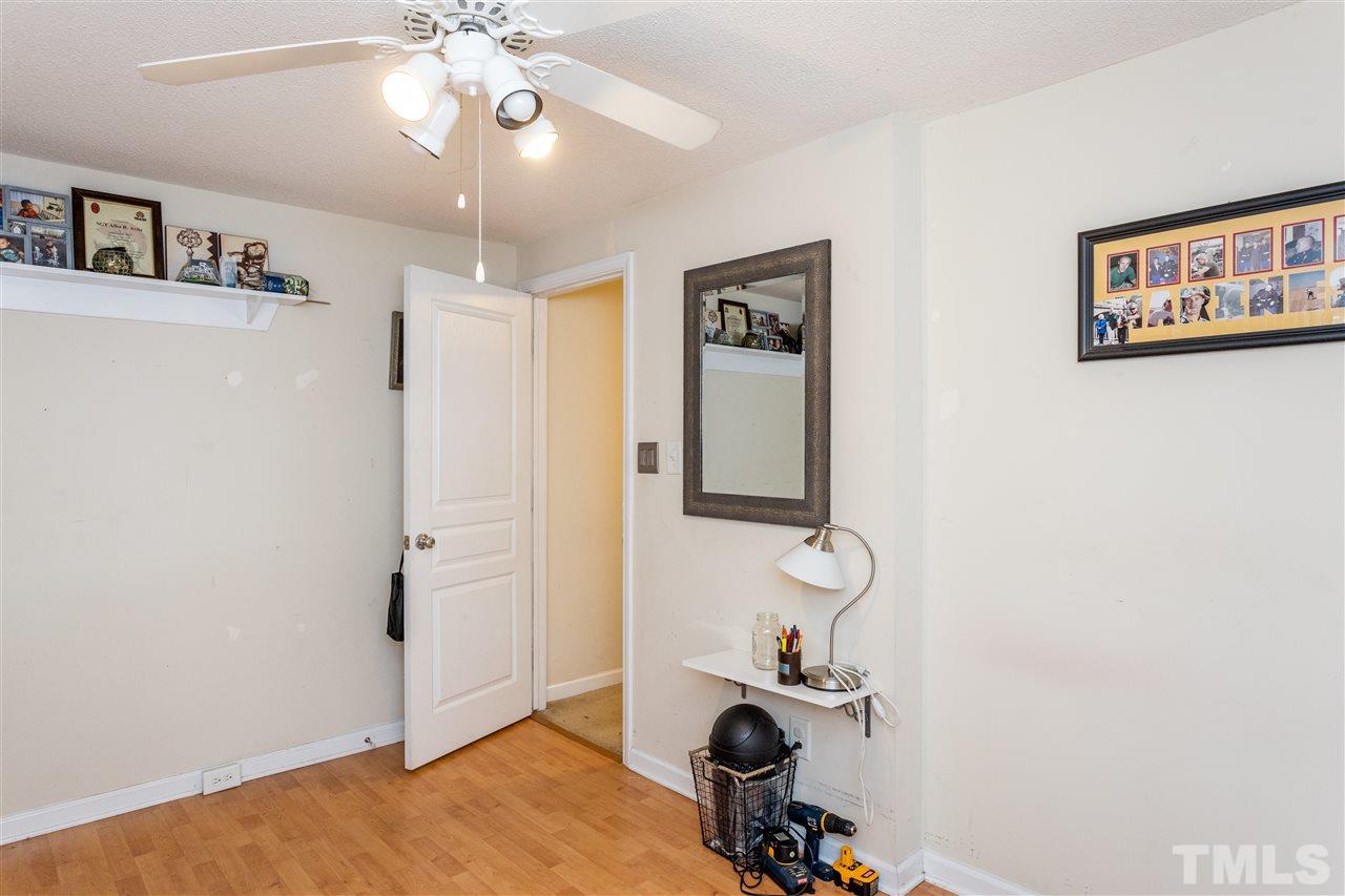 7720 Sandra Lane Raleigh, NC 27615 - Photo 15 of 25 a bathroom with a sink and a mirror