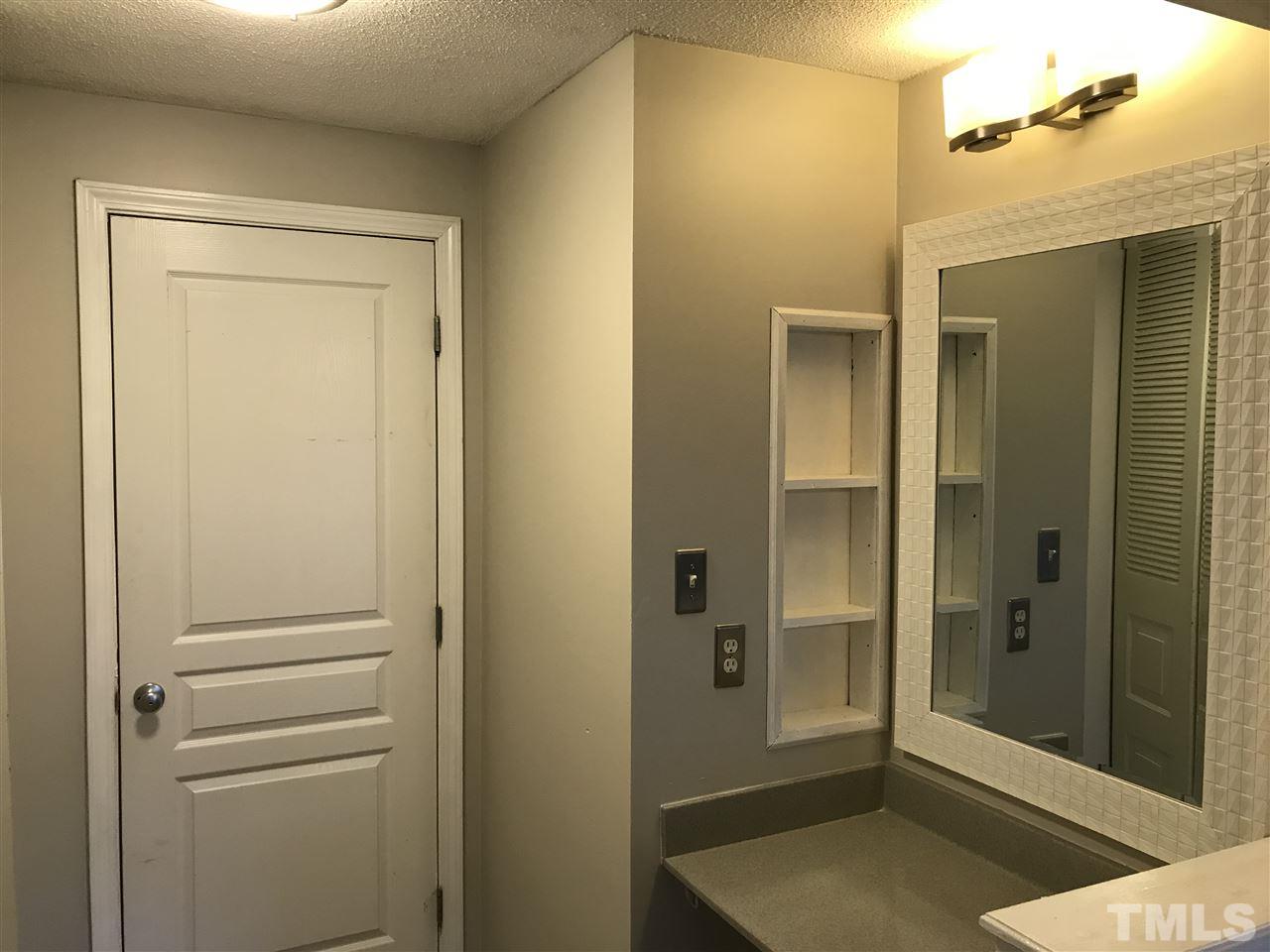 7720 Sandra Lane Raleigh, NC 27615 - Photo 23 of 25 a view of a bathroom with shower