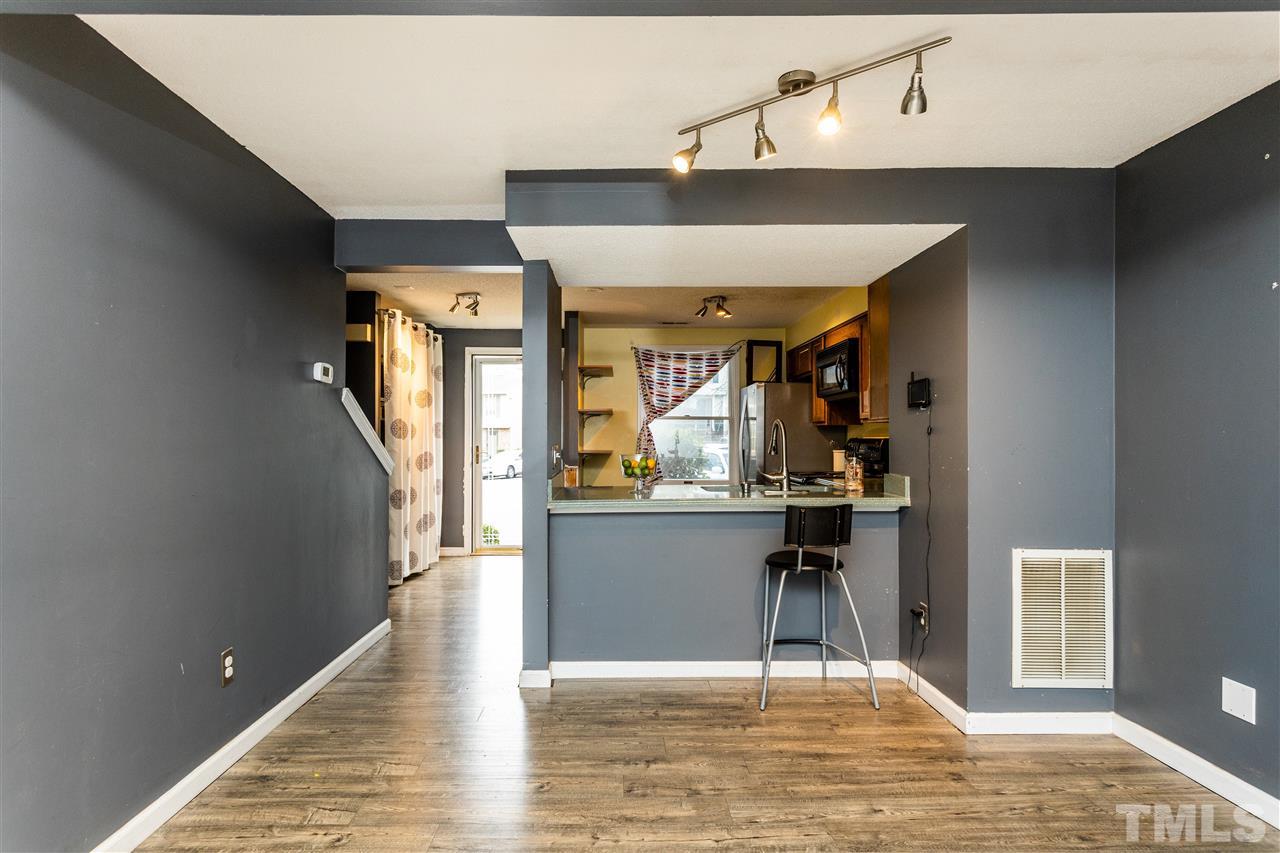 7720 Sandra Lane Raleigh, NC 27615 - Photo 9 of 25 a workspace with wooden floor