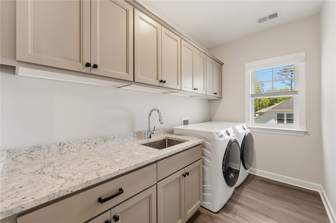 701 Weathered Oak Way Anderson, SC 29621 - Photo 24 of 41 This bright utility space features ample cabinetry, a convenient sink, and durable flooring.