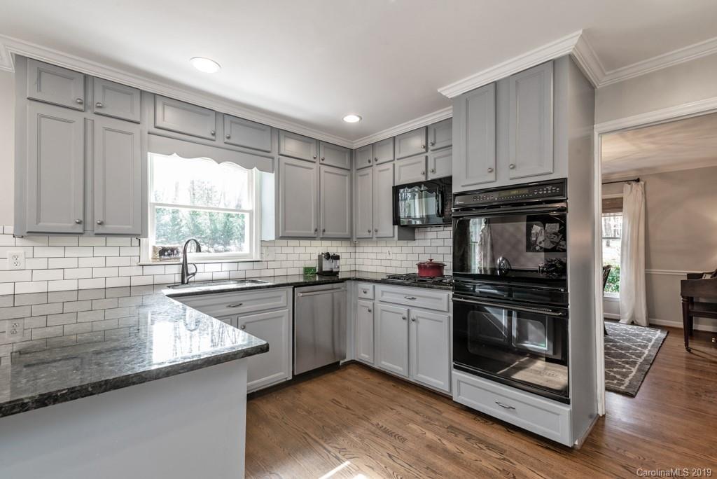 2800 High Ridge Road Charlotte, NC 28270 - Photo 11 of 34 a kitchen with a sink stove and cabinets