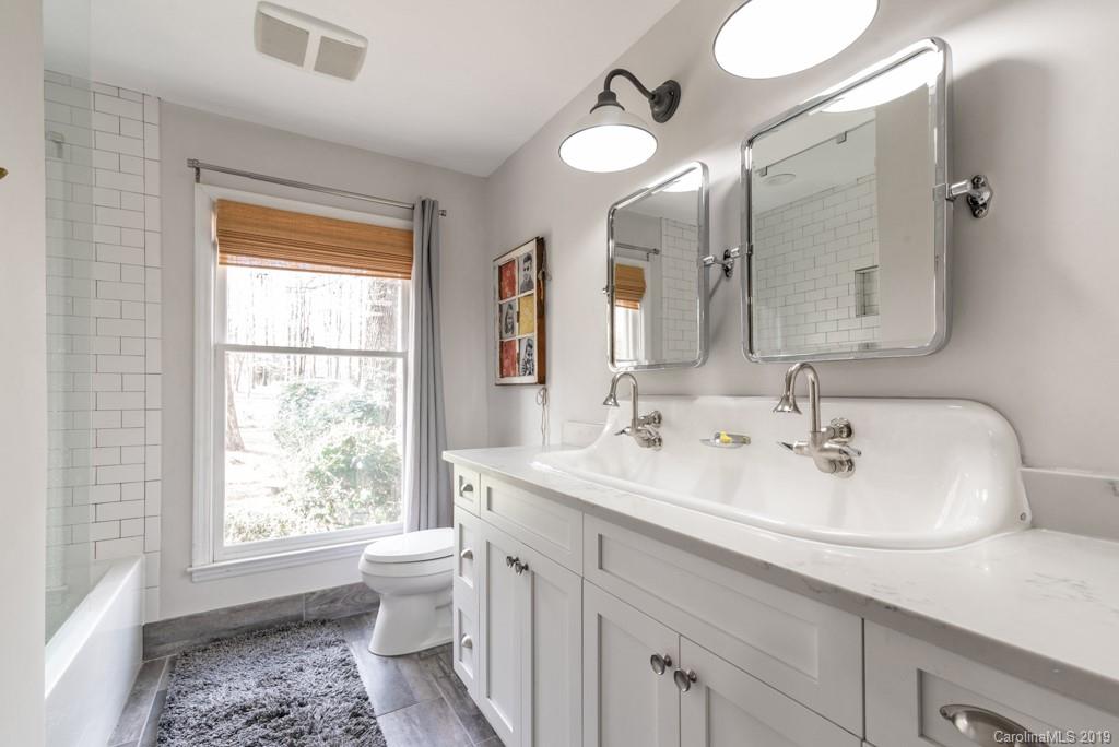 2800 High Ridge Road Charlotte, NC 28270 - Photo 20 of 34 a bathroom with a sink a toilet and a mirror