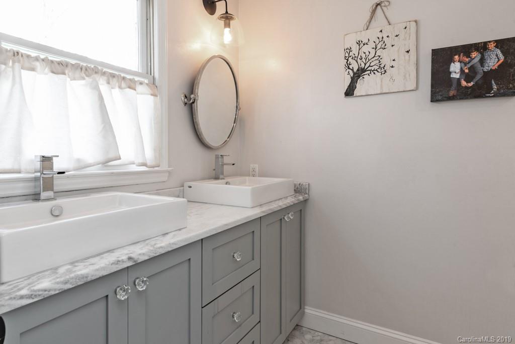 2800 High Ridge Road Charlotte, NC 28270 - Photo 22 of 34 a bathroom with a double vanity sink and a mirror