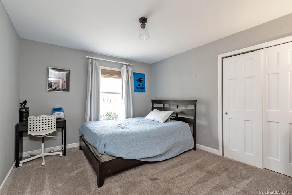 2800 High Ridge Road Charlotte, NC 28270 - Photo 24 of 34 a bedroom with a bed and a chair