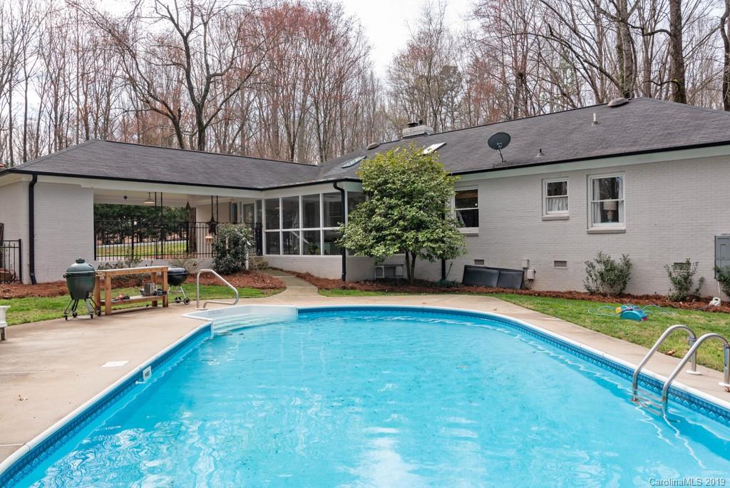 2800 High Ridge Road Charlotte, NC 28270 - Photo 29 of 34 a view of swimming pool with lawn chairs and plants