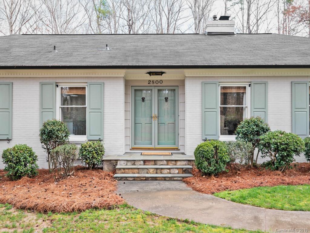 2800 High Ridge Road Charlotte, NC 28270 - Photo 4 of 34 a front view of a house with a yard and potted plants