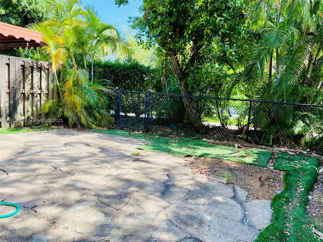 a view of backyard with green space