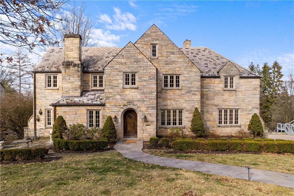 756 Osage Road Pittsburgh, PA 15243 - Photo 1 of 29 a view of a white house with large windows next to a yard
