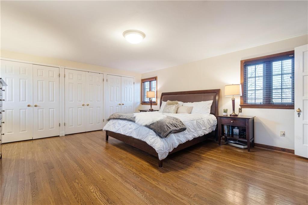 756 Osage Road Pittsburgh, PA 15243 - Photo 18 of 29 a bedroom with a bed and wooden floor