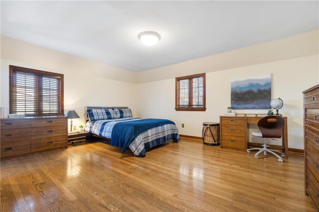 756 Osage Road Pittsburgh, PA 15243 - Photo 21 of 29 a bedroom with a bed and a chair