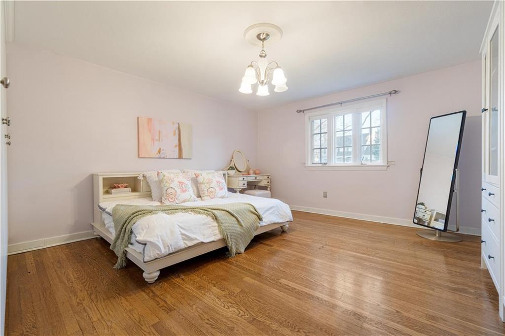756 Osage Road Pittsburgh, PA 15243 - Photo 22 of 29 a spacious bedroom with a bed and a window
