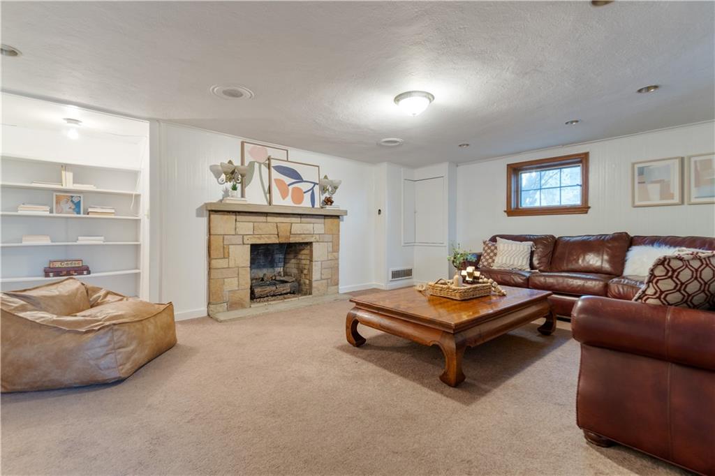 756 Osage Road Pittsburgh, PA 15243 - Photo 26 of 29 a living room with furniture and a fireplace