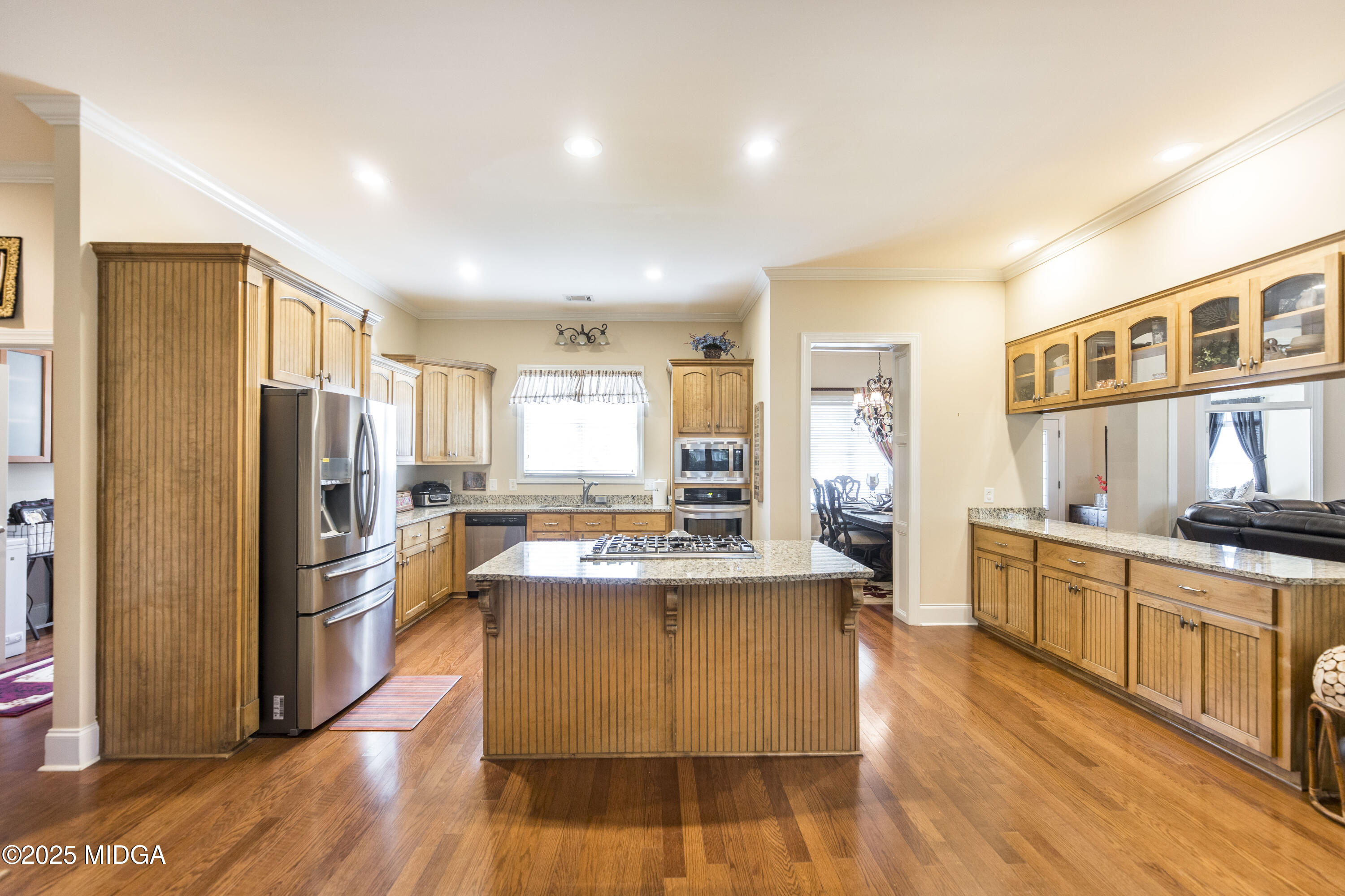 711 Latrobe Way Macon, GA 31220 - Photo 15 of 44 a kitchen with stainless steel appliances granite countertop a refrigerator a stove top oven a sink dishwasher and white cabinets with wooden floor