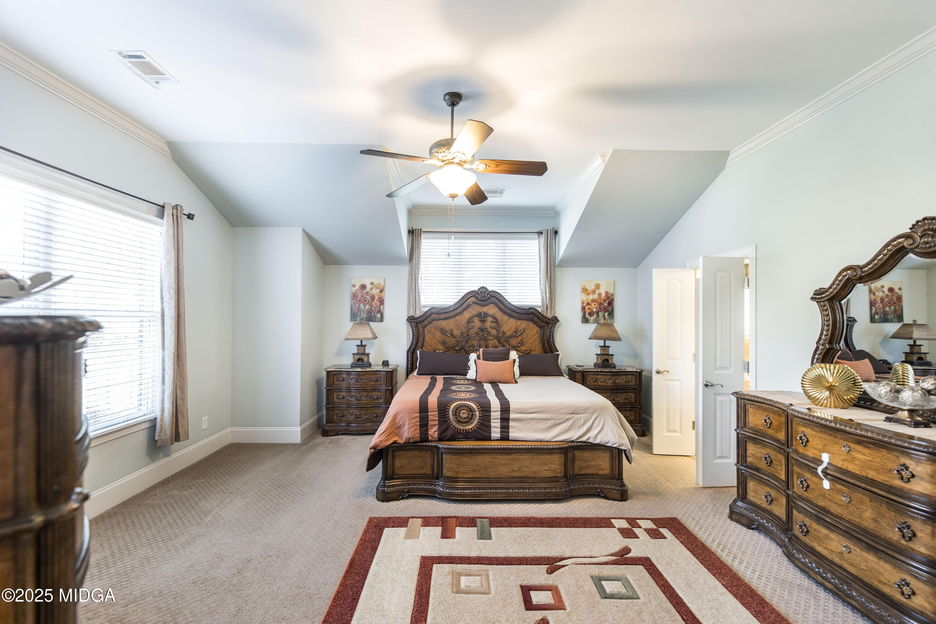 711 Latrobe Way Macon, GA 31220 - Photo 21 of 44 a bedroom with furniture and a chandelier