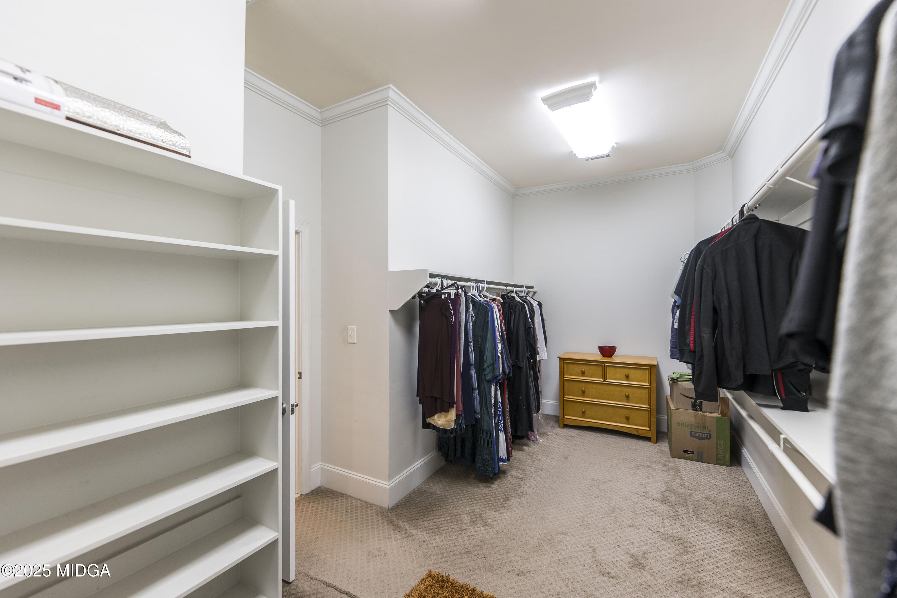 711 Latrobe Way Macon, GA 31220 - Photo 26 of 44 a view of walk in closet with clothes and shoes