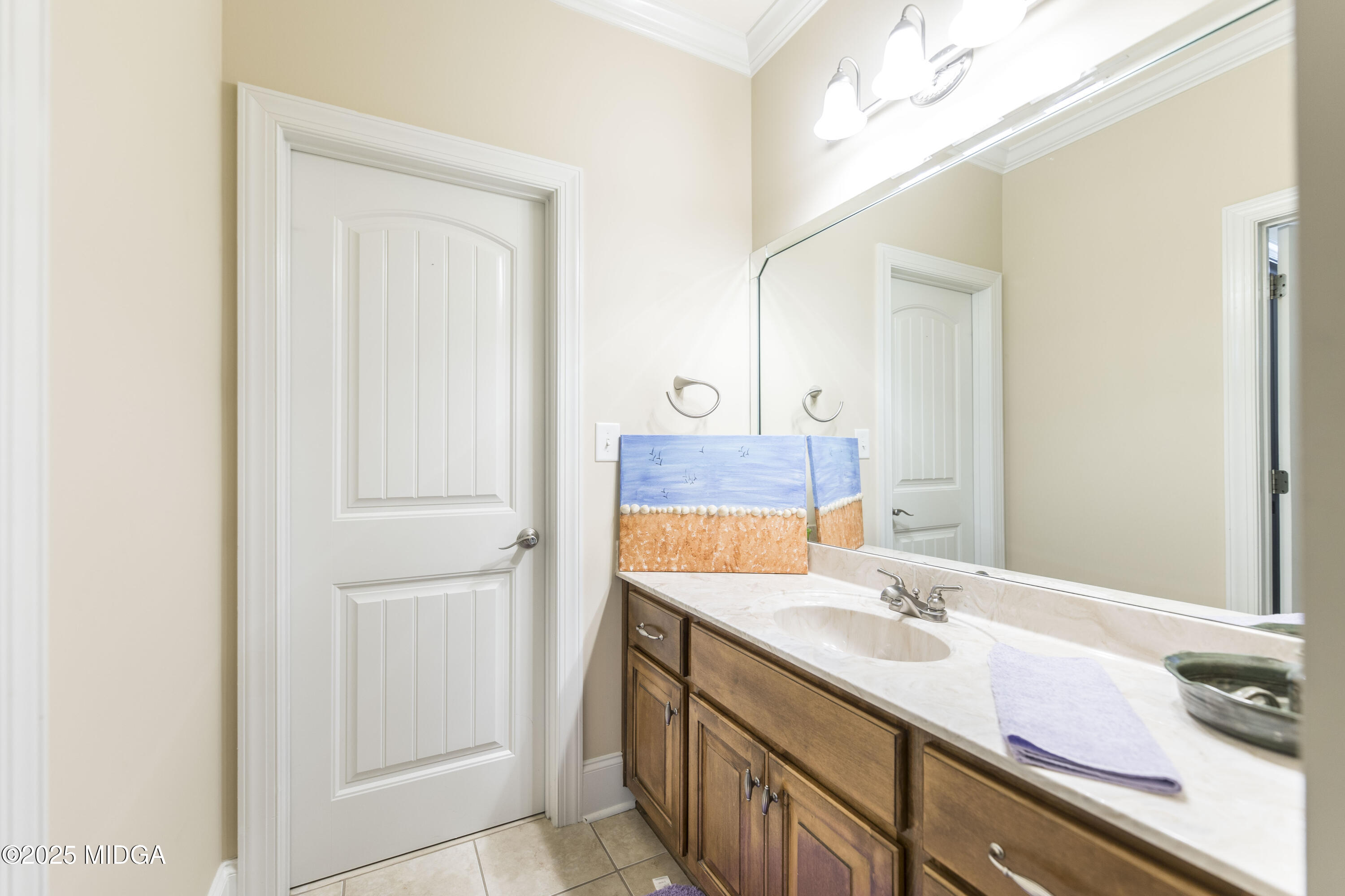 711 Latrobe Way Macon, GA 31220 - Photo 31 of 44 a bathroom with a sink and a mirror