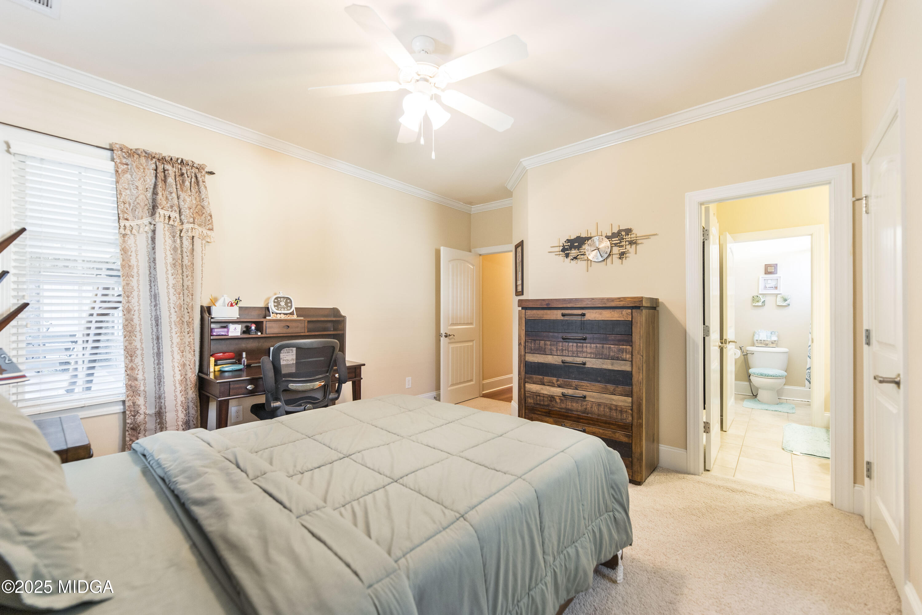 711 Latrobe Way Macon, GA 31220 - Photo 34 of 44 a bedroom with a bed and dresser with mirror