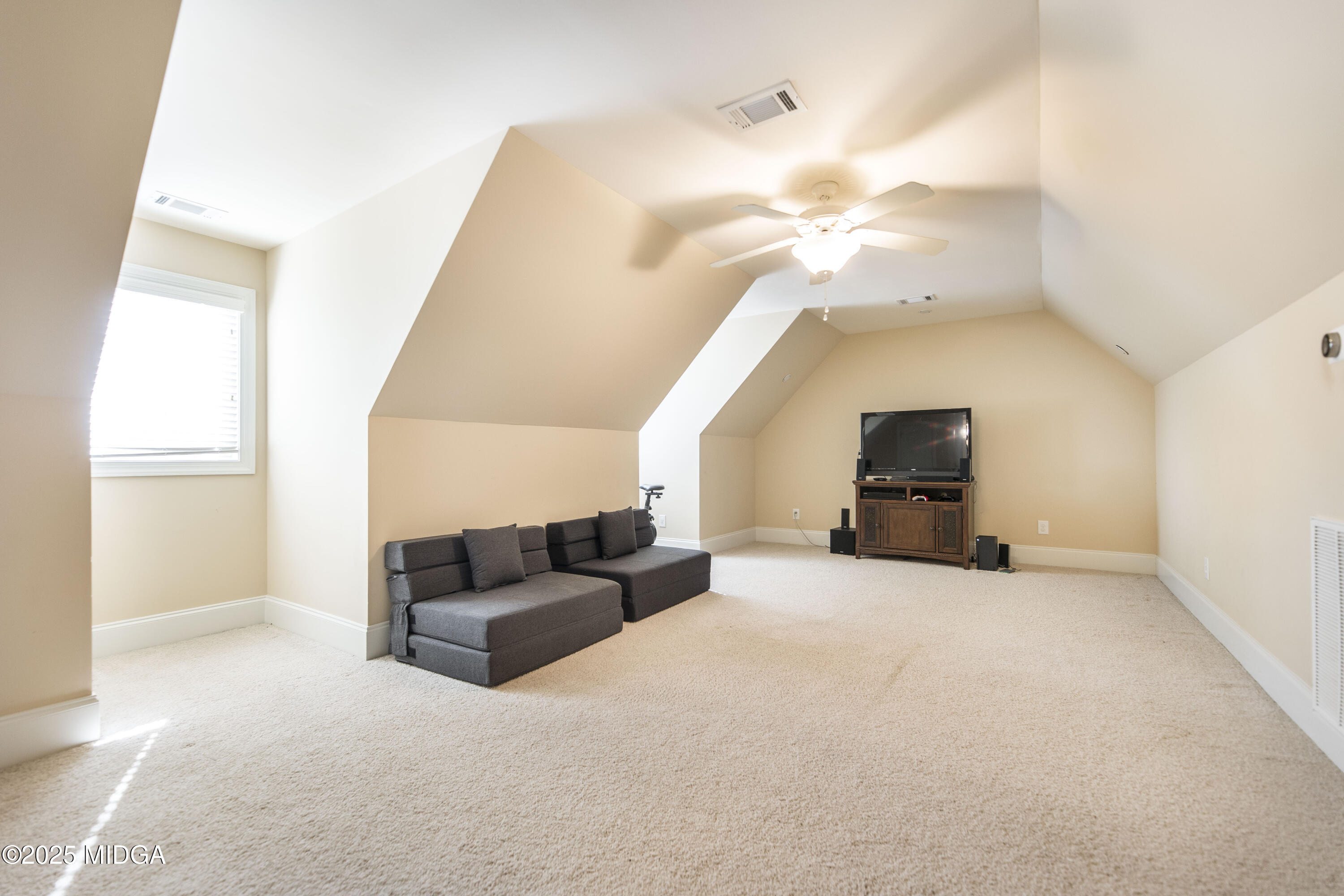 711 Latrobe Way Macon, GA 31220 - Photo 35 of 44 a living room with furniture and a chandelier