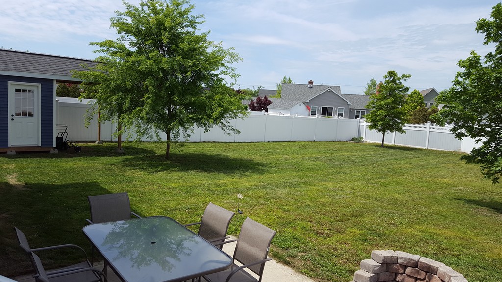 4 Mary Street Springfield, MA 01118 - Photo 3 of 16 a view of a chairs and table in backyard of the house