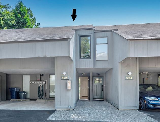 a bathroom with a shower curtain and a sink