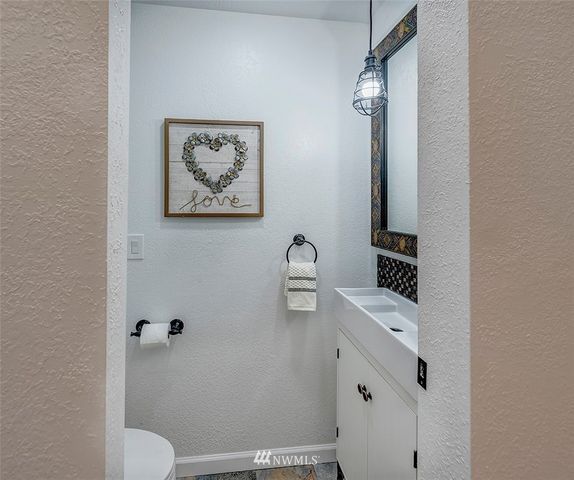 a kitchen with a refrigerator and a stove