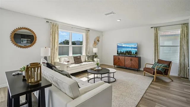 a living room with furniture and a window