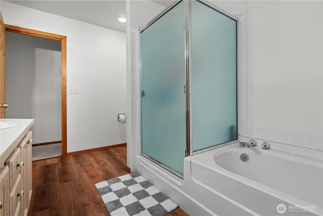 a bathroom with a bathtub and a sink