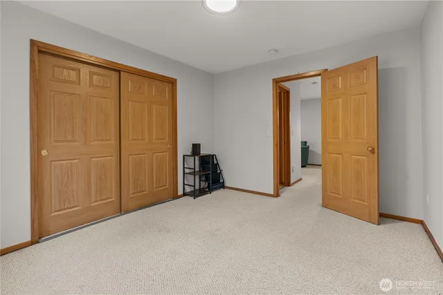 an empty room with closet area