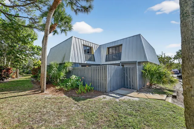 a house with trees in front of it