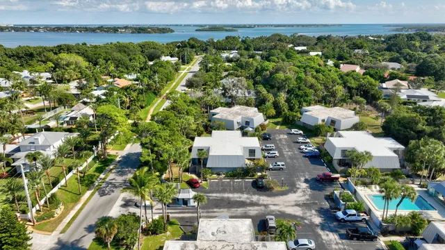 a view of lake and houses with outdoor space
