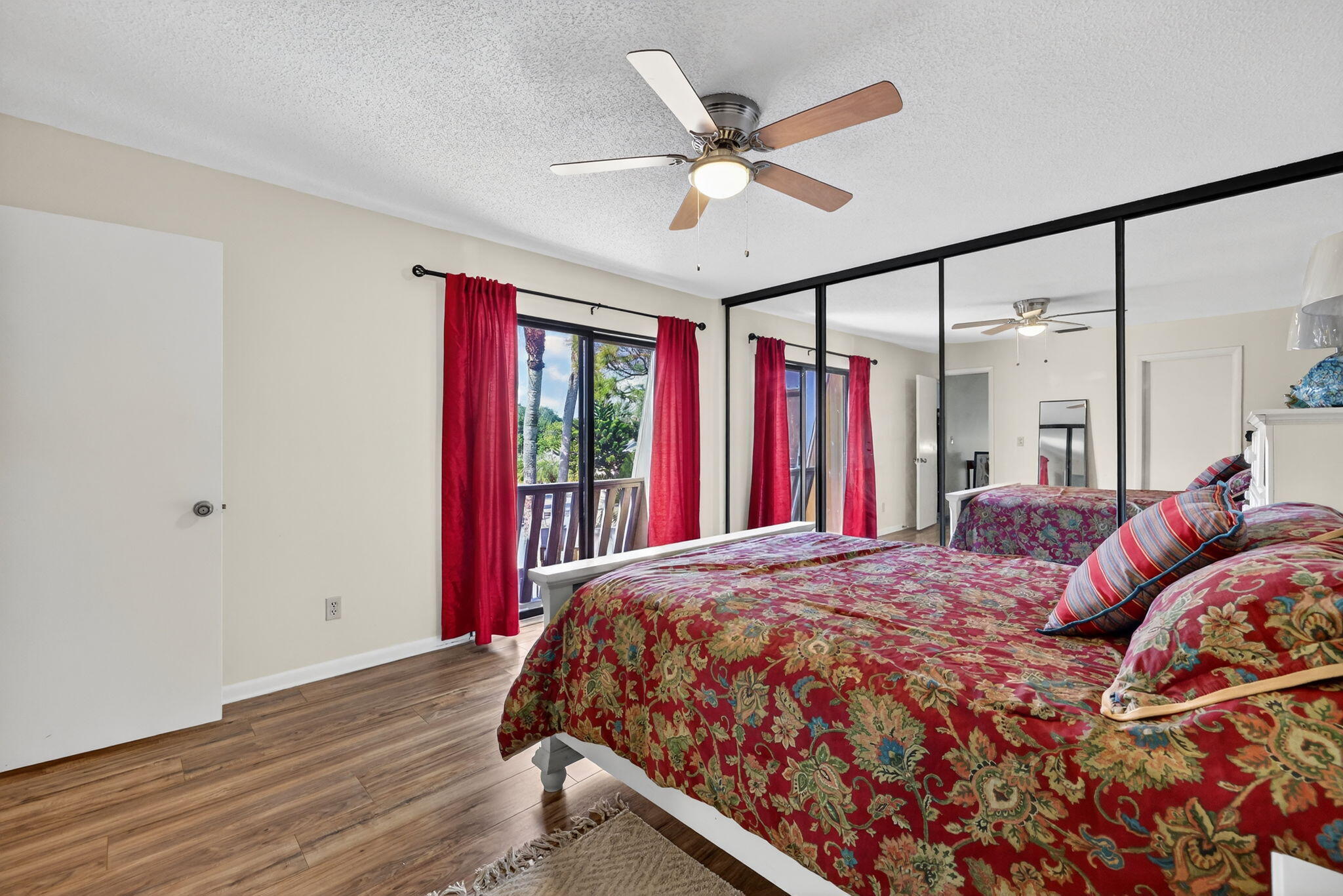 3860 Jefferson Street Stuart, FL 34997 - Photo 9 of 26 a bed sitting in a bedroom next to a window