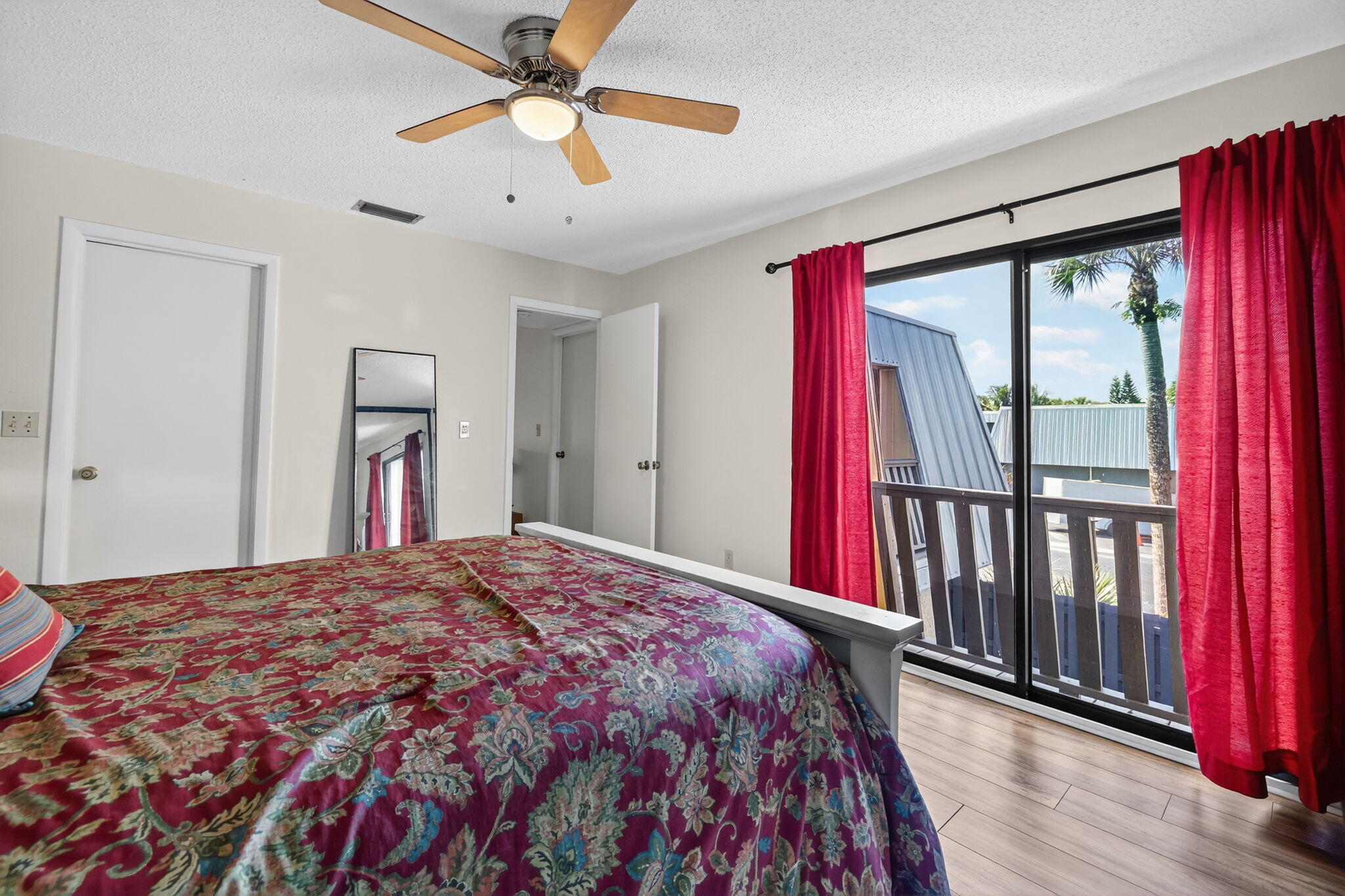 3860 Jefferson Street Stuart, FL 34997 - Photo 10 of 26 a bedroom with a bed and a chandelier