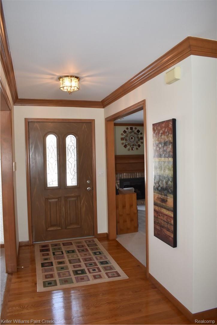 1993 Ridgefield Court Rochester, MI 48306 - Photo 8 of 47 THE OPENING TO THE RIGHT OF THE FRONT DOOR LEADS TO THE LARGE LIBRARY/STUDY (11 X 15). THE OPENING TO THE LEFT LEADS TO THE LARGE FORMAL DINIG ROOM (11 X 13). CHECK OUT THE WOOD FLOOR IN THE FOYER!
