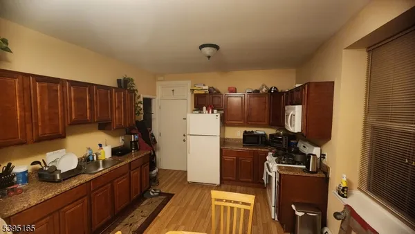 a kitchen with refrigerator and stove