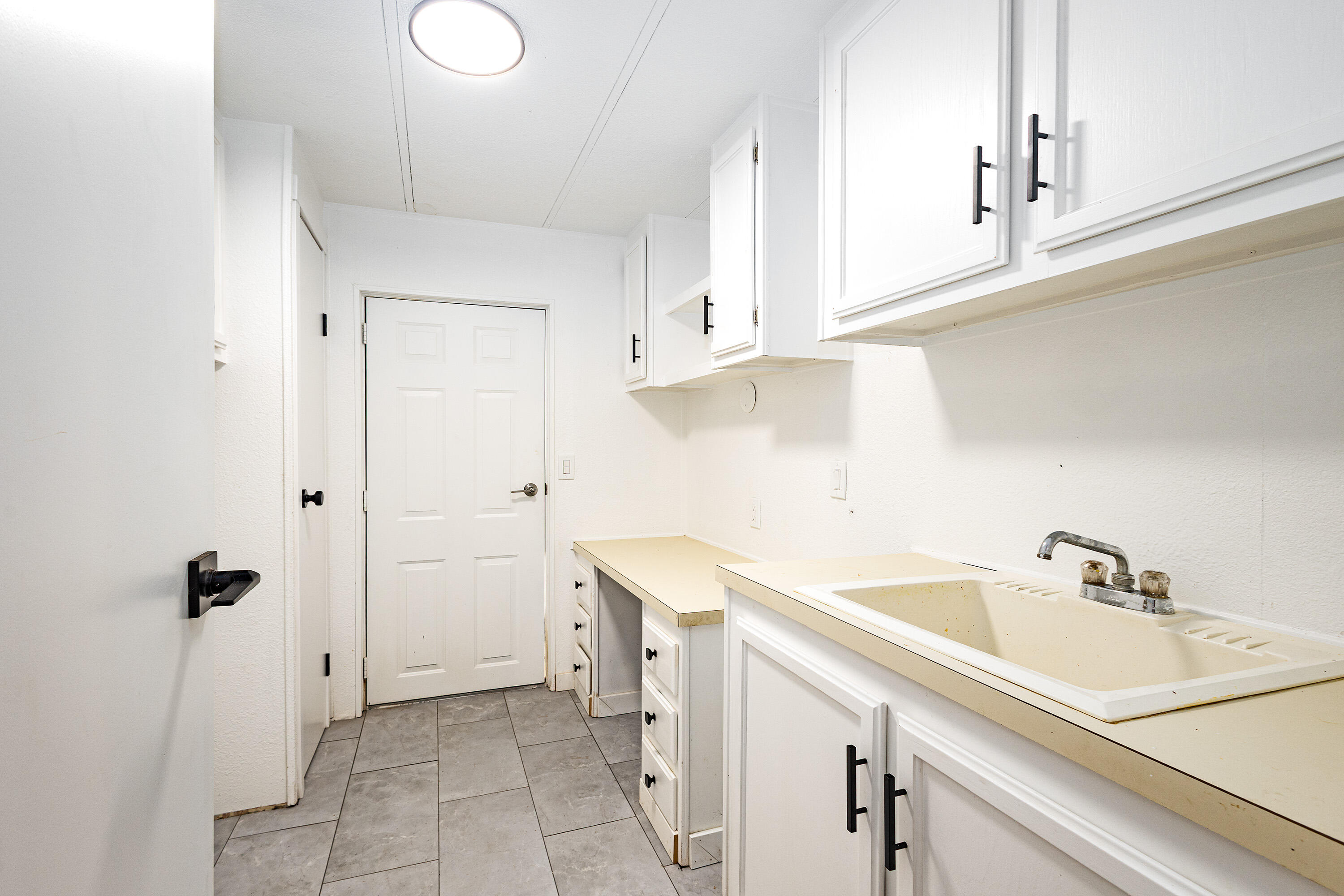 601 Pinewood Way Cave Junction, OR 97523 - Photo 18 of 33 a view of a kitchen with white cabinets