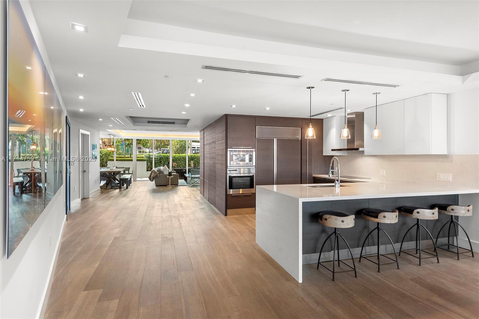 400 Alton Road, Unit 509 Miami Beach, FL 33139 - Photo 17 of 36 custom built in storage with custom shelving behind panels that were custom made for unit