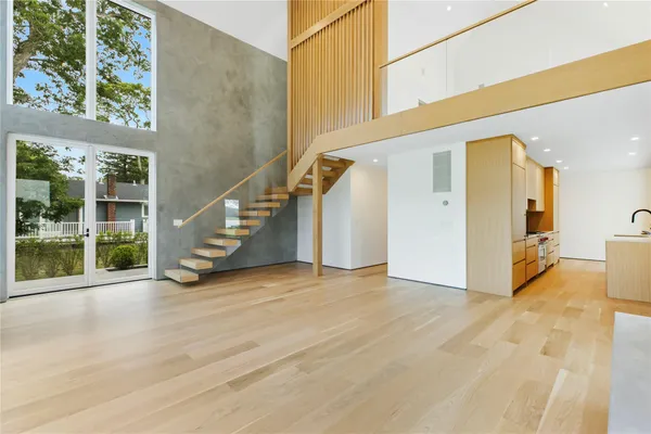 a view of an entryway with wooden floor