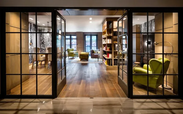 a view of a living room with wooden floor