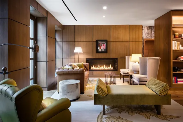 a bedroom with furniture and a fireplace