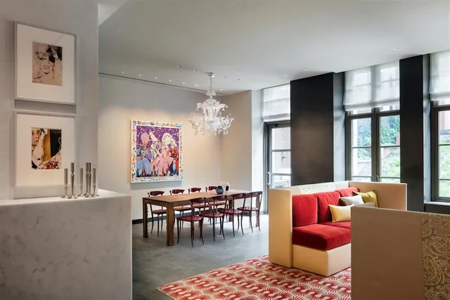 a living room with furniture a rug and a floor