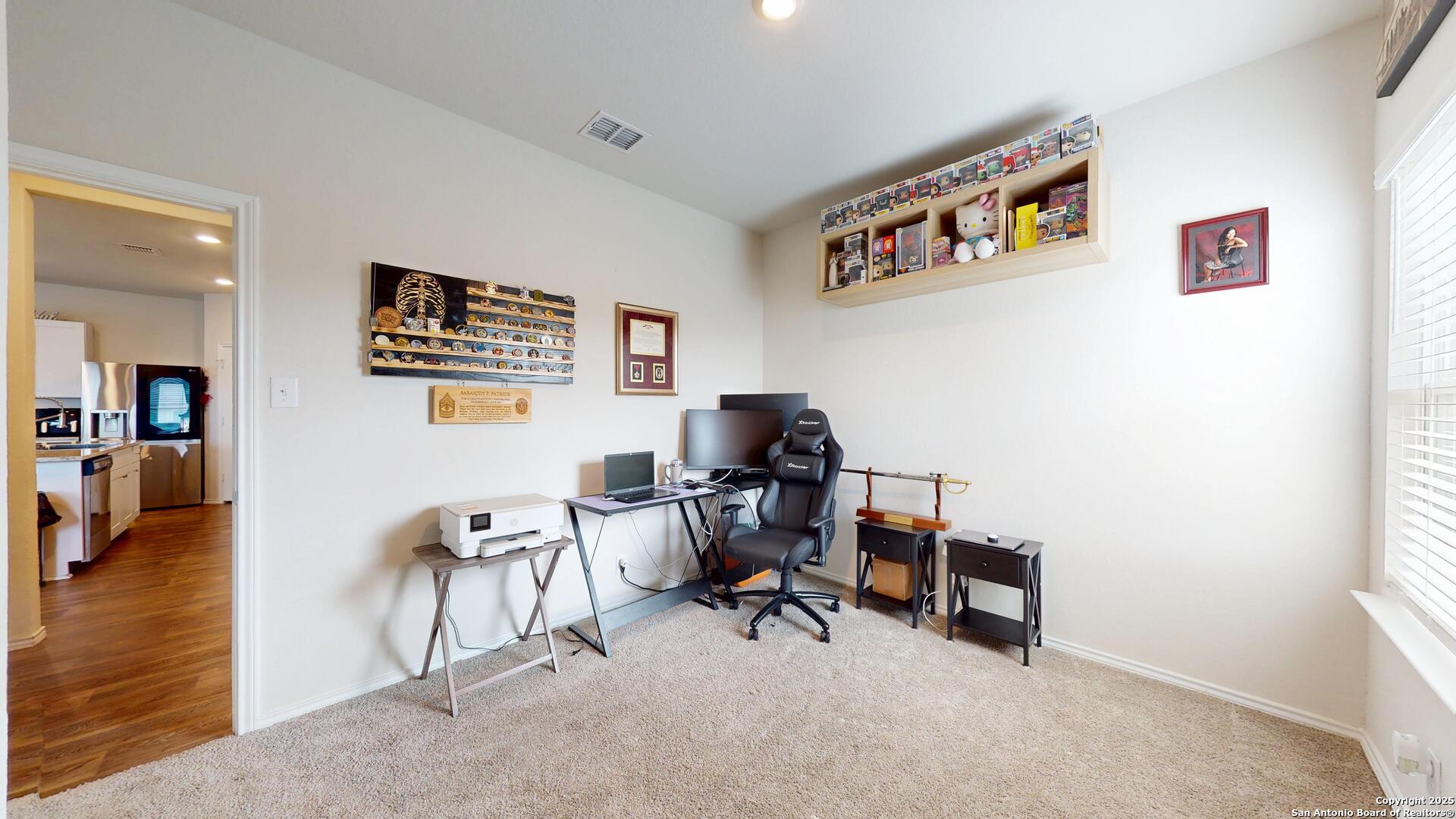 4021 Lilac Path St. Hedwig, TX 78152 - Photo 18 of 49 a view of a workspace with furniture and a window