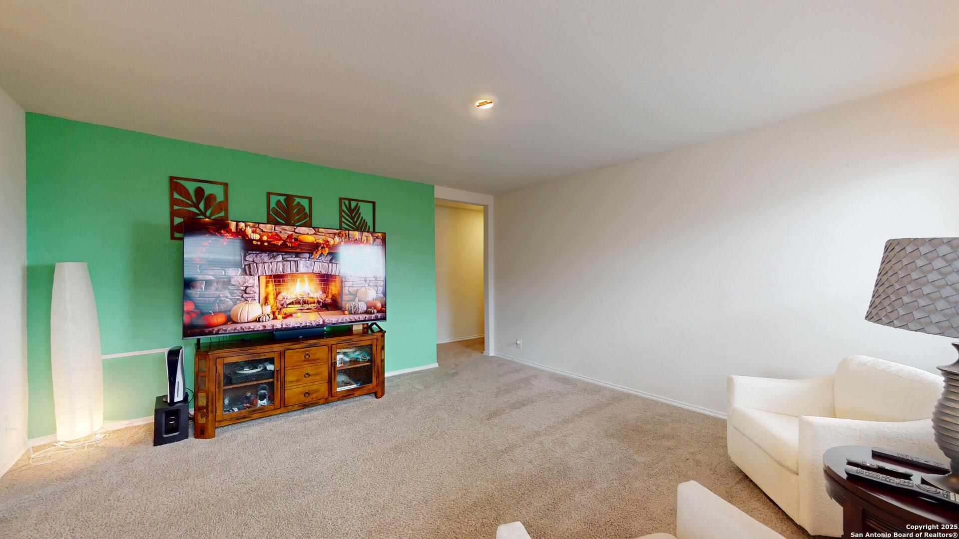 4021 Lilac Path St. Hedwig, TX 78152 - Photo 21 of 49 a living room with furniture and a flat screen tv