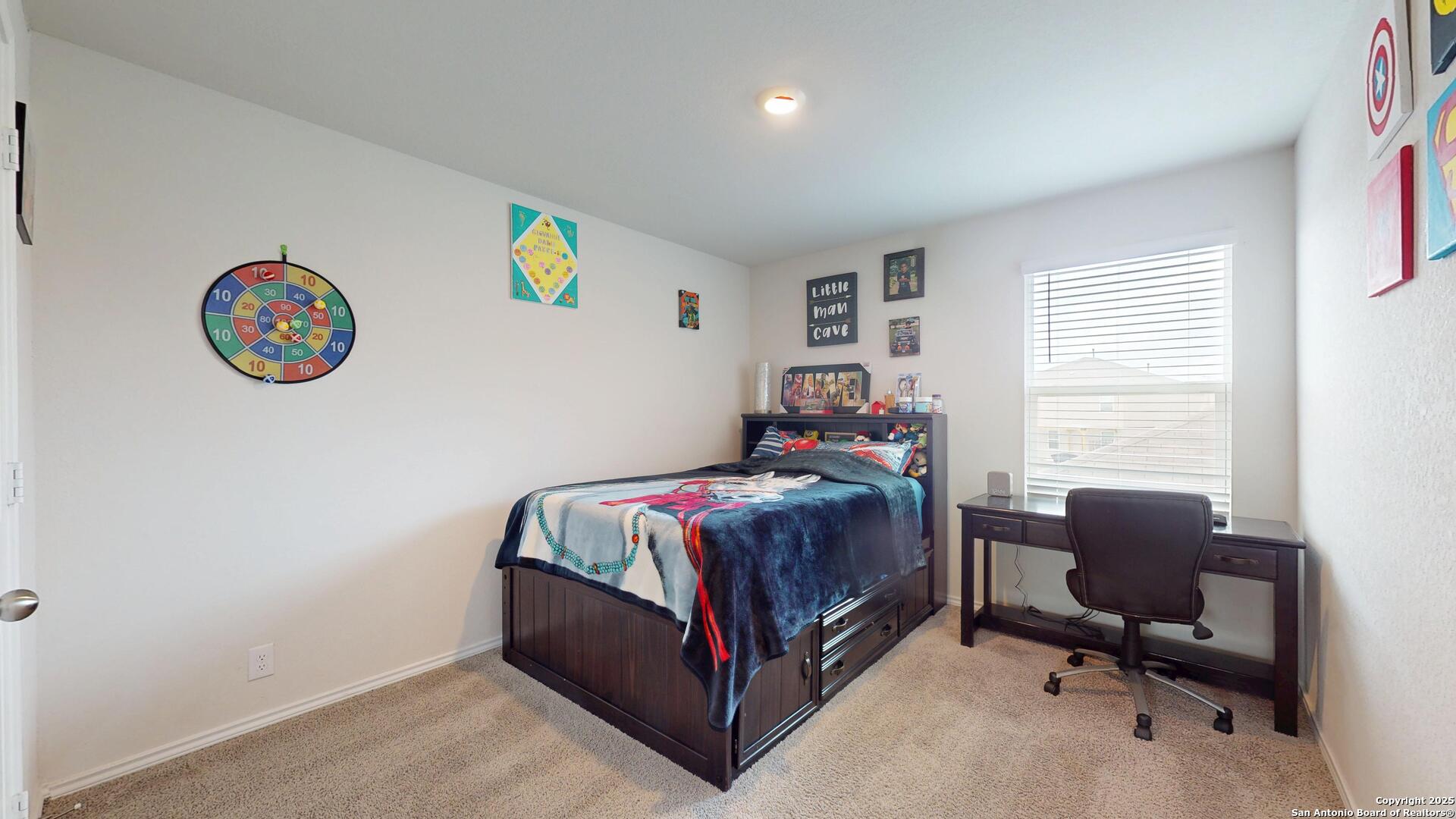 4021 Lilac Path St. Hedwig, TX 78152 - Photo 28 of 49 a bedroom with a bed and a desk