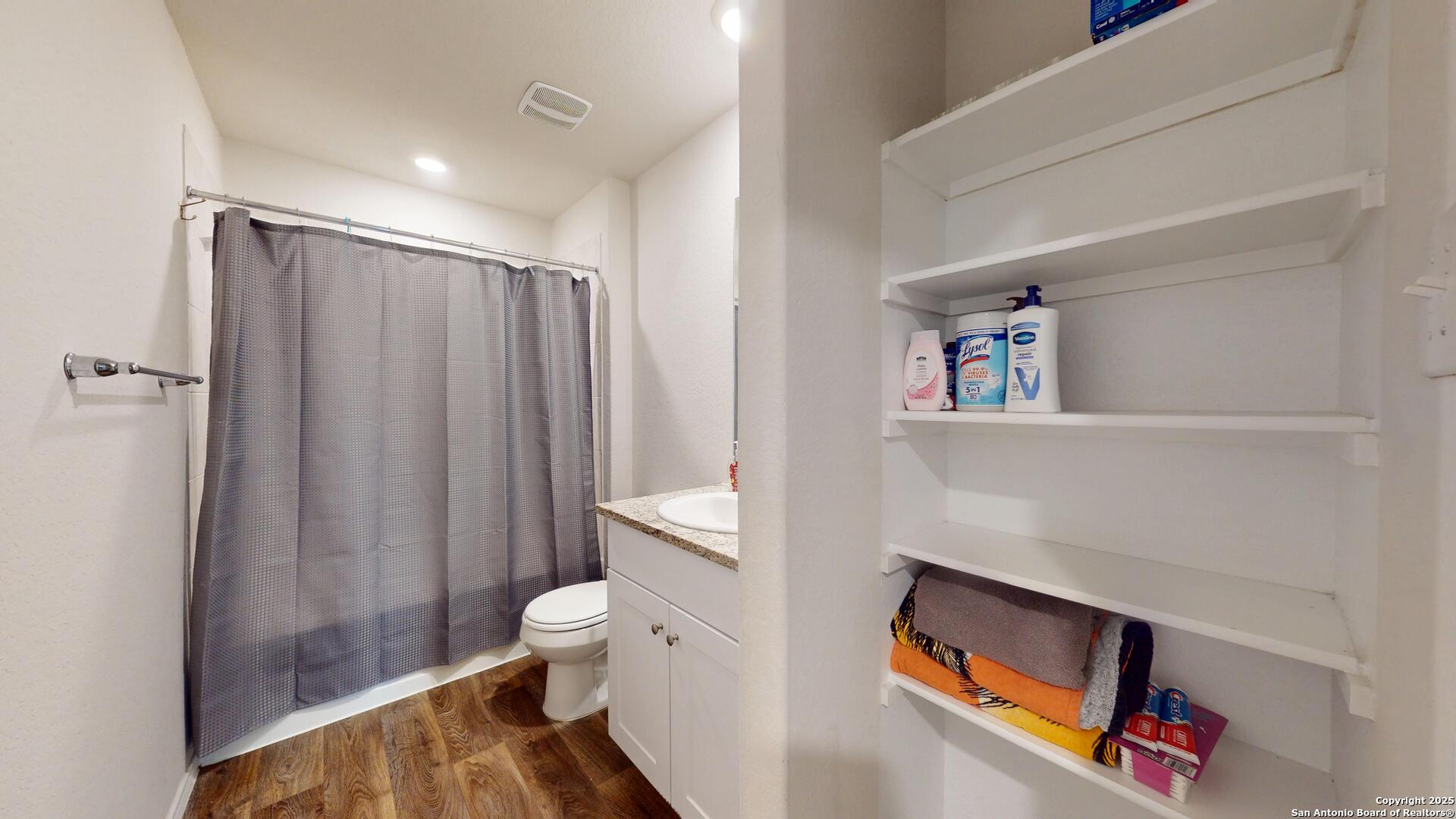 4021 Lilac Path St. Hedwig, TX 78152 - Photo 34 of 49 a bathroom with a toilet and a shower