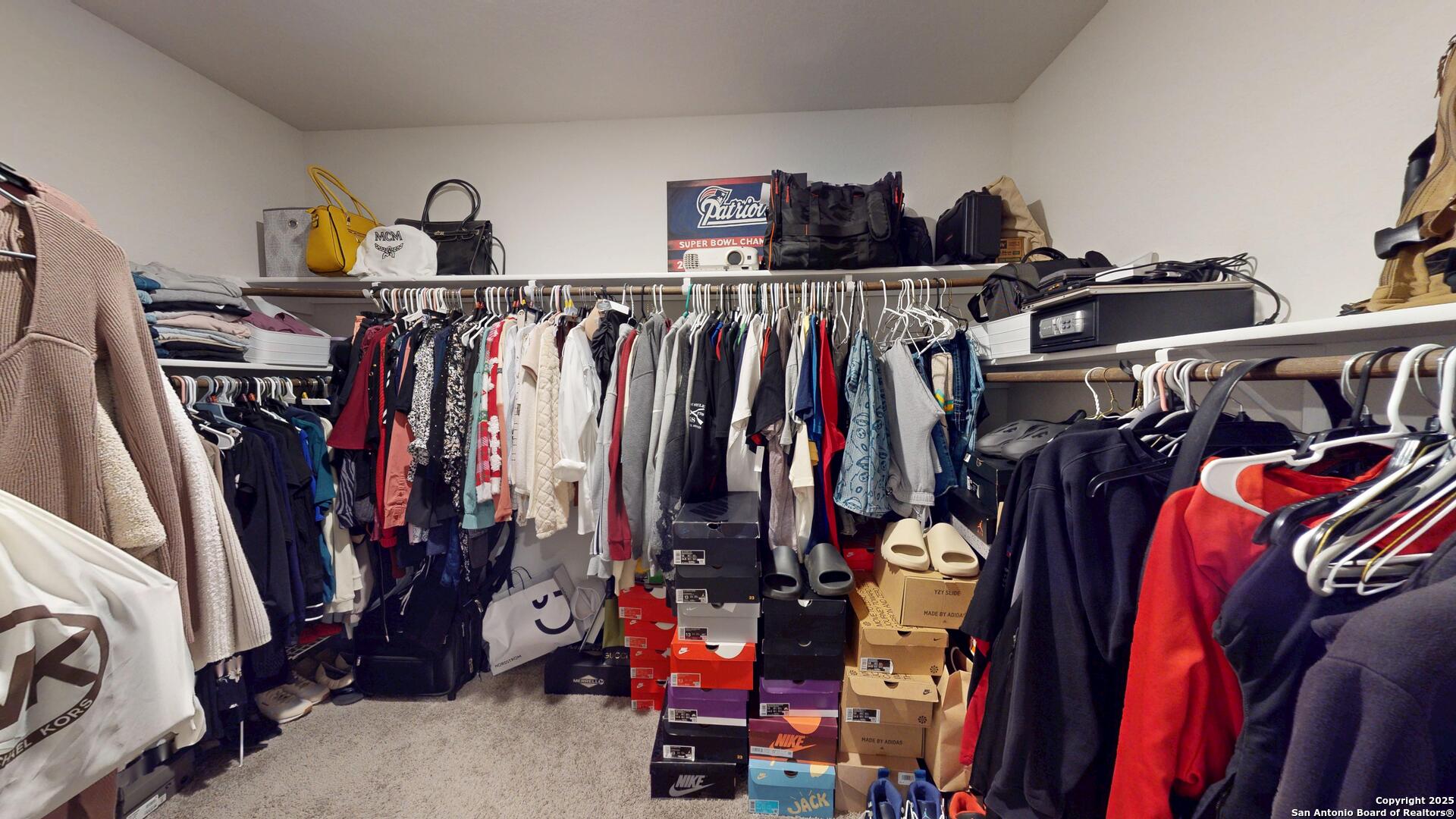 4021 Lilac Path St. Hedwig, TX 78152 - Photo 43 of 49 a view of walk in closet with clothes and shoes