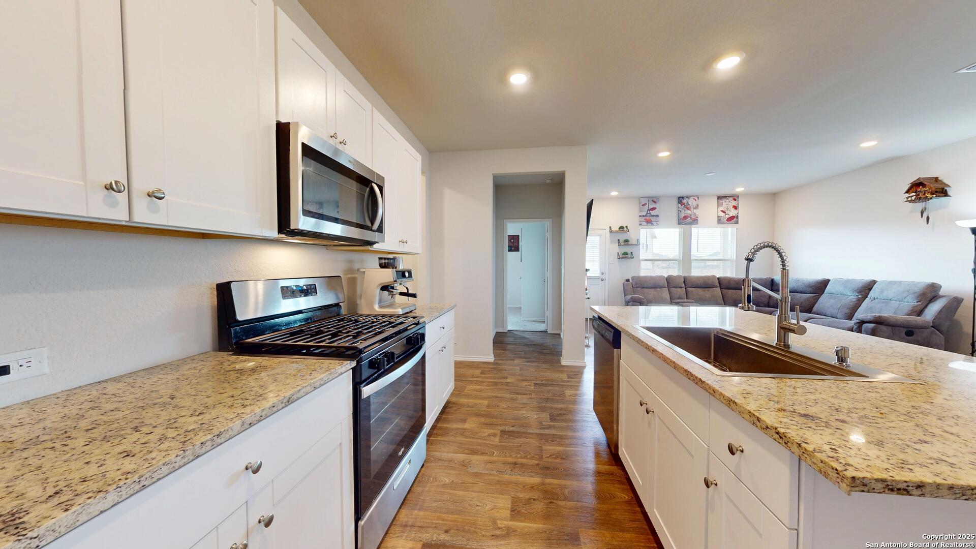 4021 Lilac Path St. Hedwig, TX 78152 - Photo 8 of 49 a large kitchen with stainless steel appliances granite countertop a lot of counter space