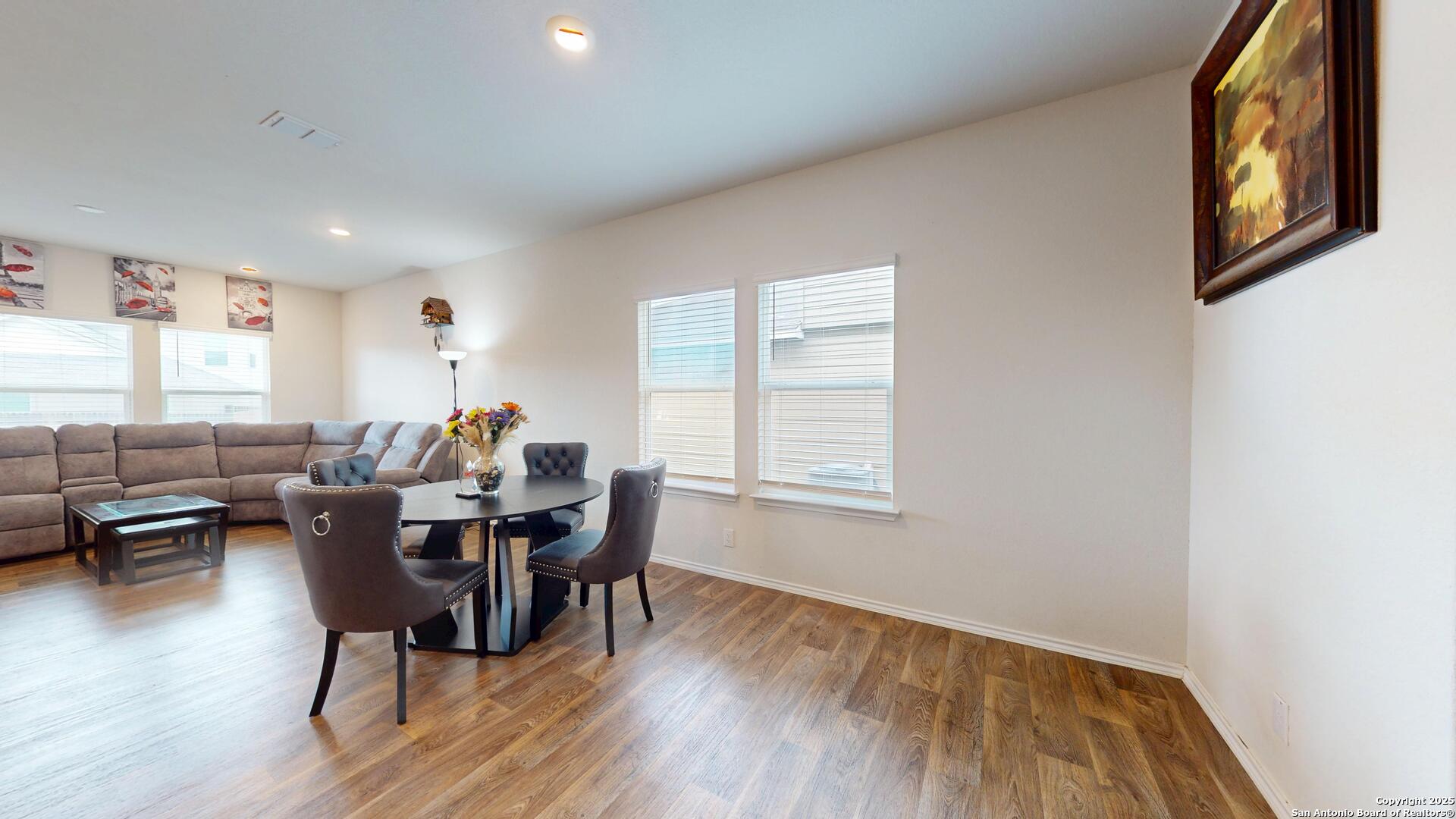 4021 Lilac Path St. Hedwig, TX 78152 - Photo 9 of 49 a dining room with wooden floor and furniture