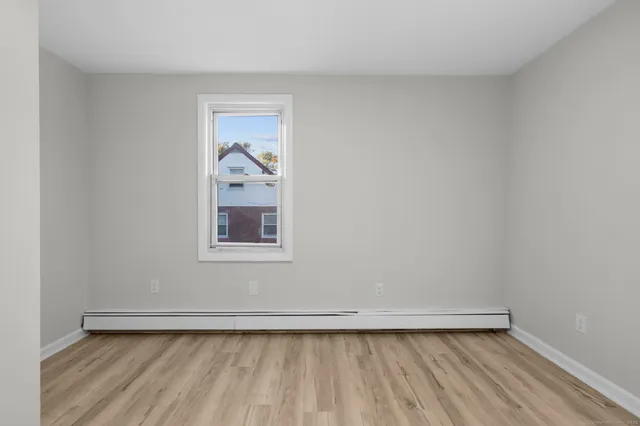 a view of a refrigerator and window in a room